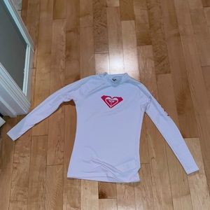 women’s small swim shirt, very light on the skin, covers up really well.